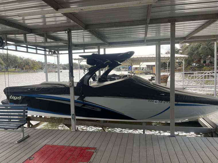 Tigé wake boat on a covered boat lift