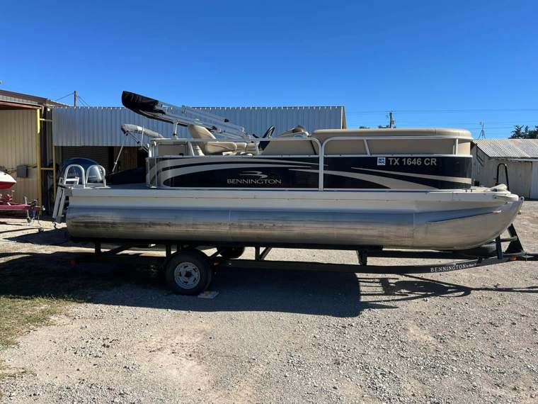 Bennington pontoon boat on a trailer at the shop